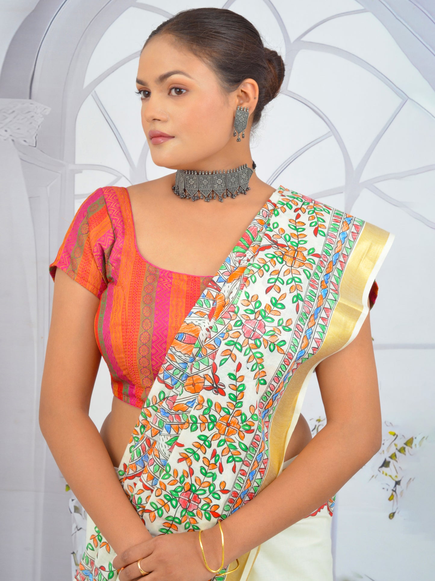 Traditional Kerala cotton saree with hand-painted floral Madhubani motifs