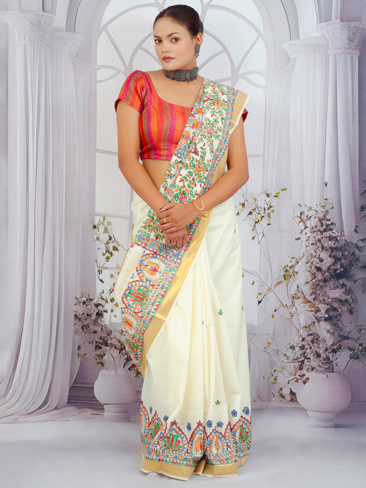 Elegant white cotton saree with colorful floral Madhubani painting