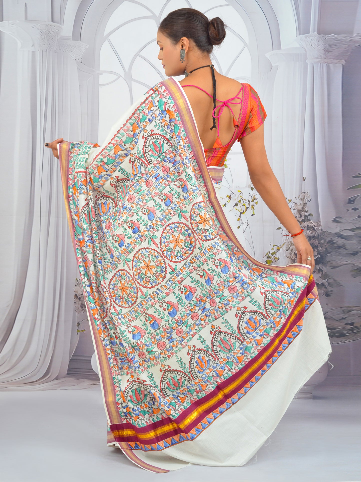 Ethnic Kerala cotton saree with floral Madhubani painting and maroon edge