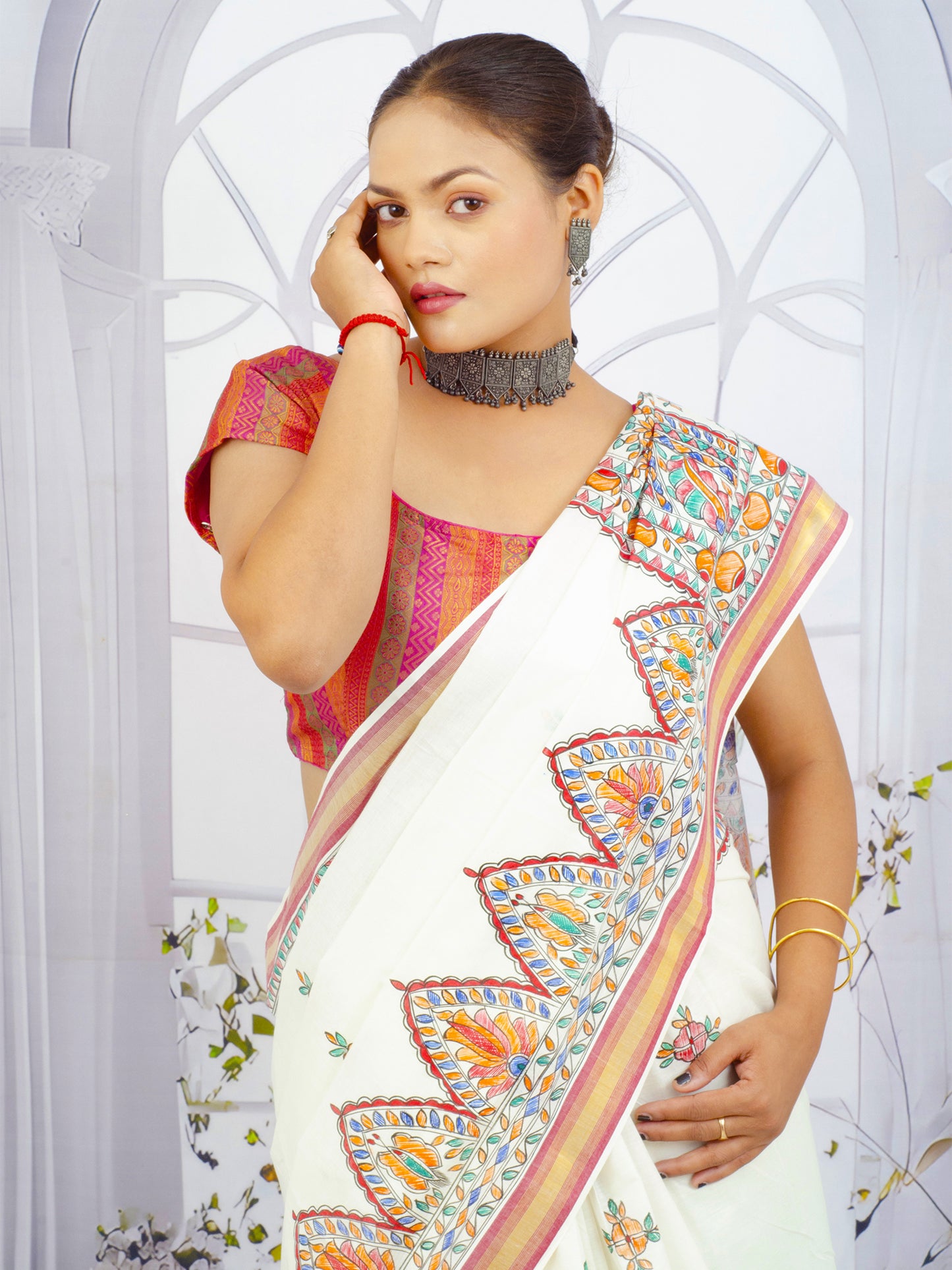 Close-up of floral Madhubani artwork on handloom Kerala cotton saree