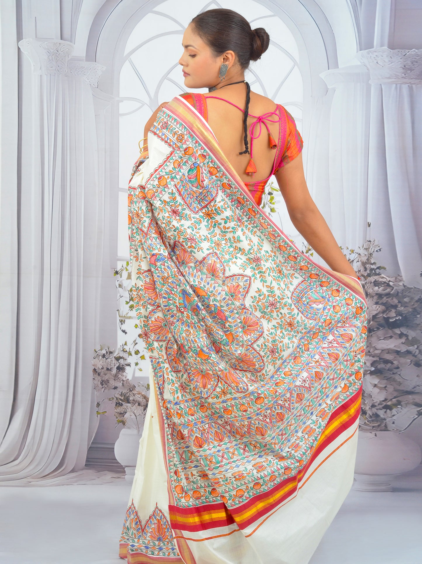 Model wearing Floral Madhubani Kerala Cotton Saree with Red Border