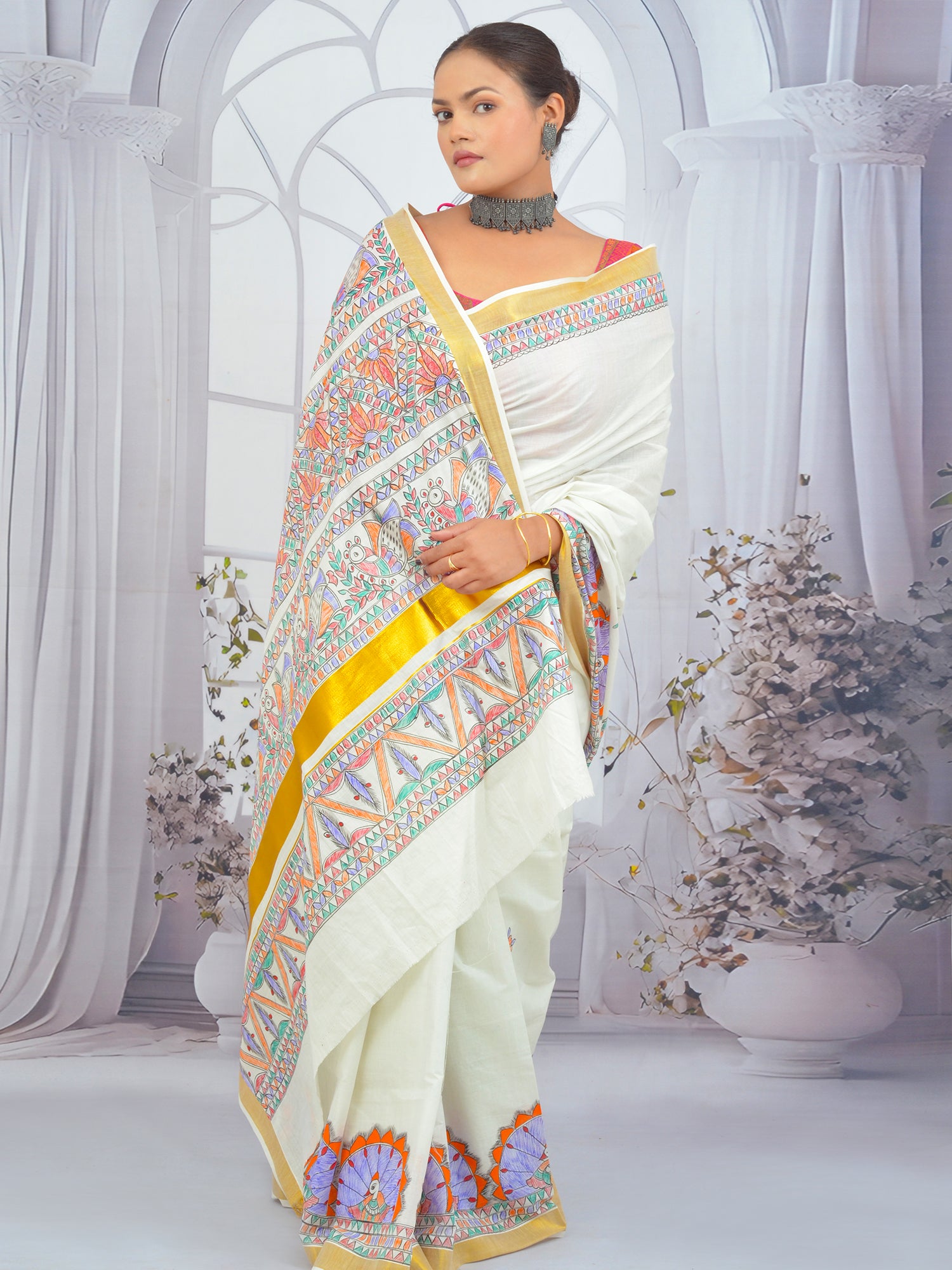 Elegant Madhubani floral Kerala saree with hand-painted design and gold border