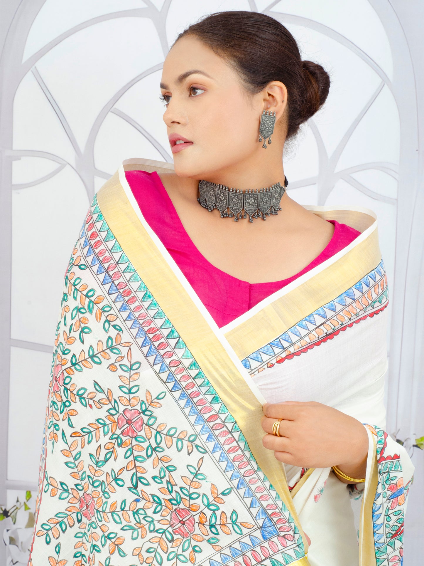 White Kerala Cotton Saree Featuring Madhubani Floral Artwork and Gold Zari Border