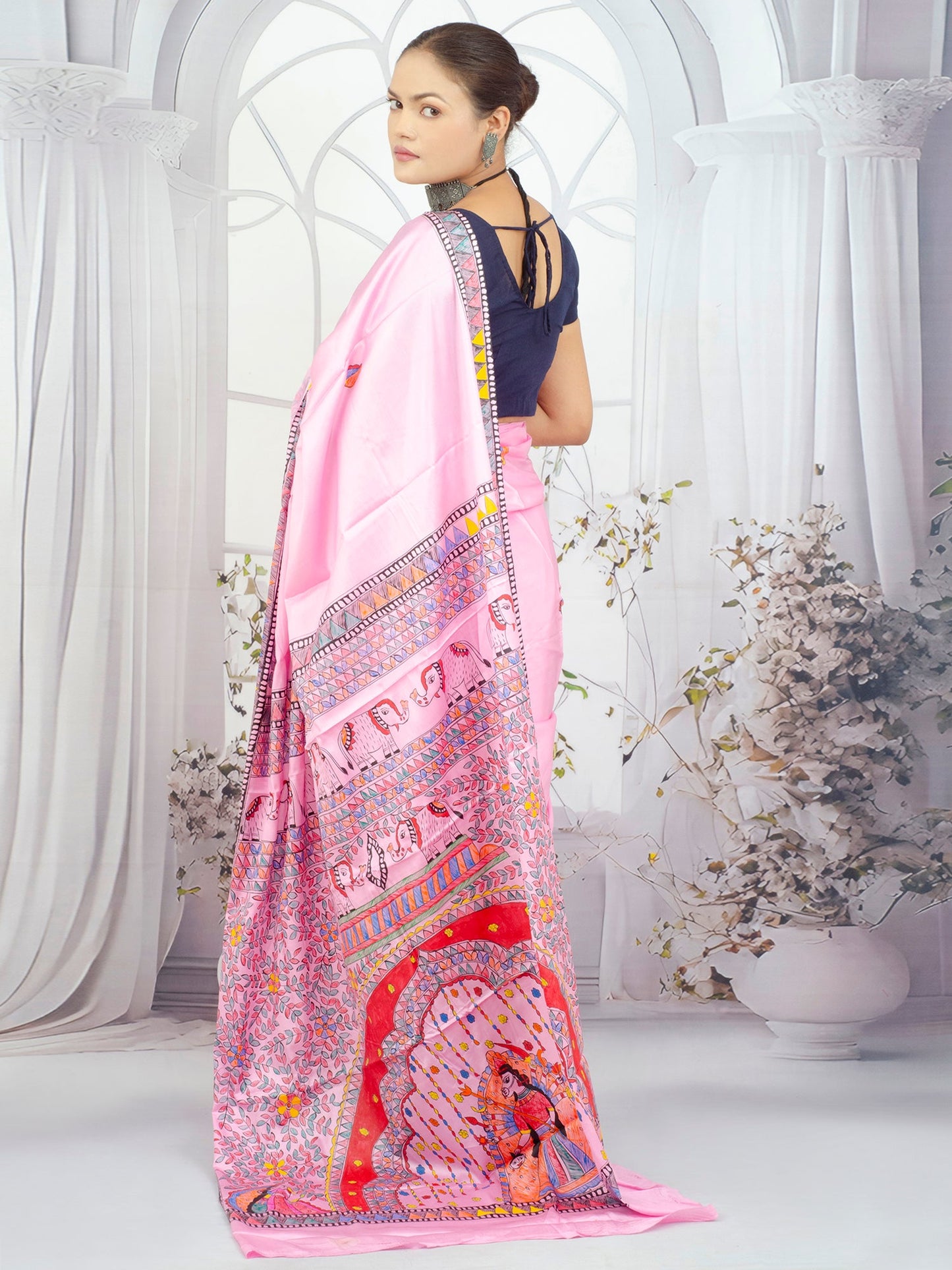 Hand-painted Madhubani artwork on pure crepe silk saree in pink