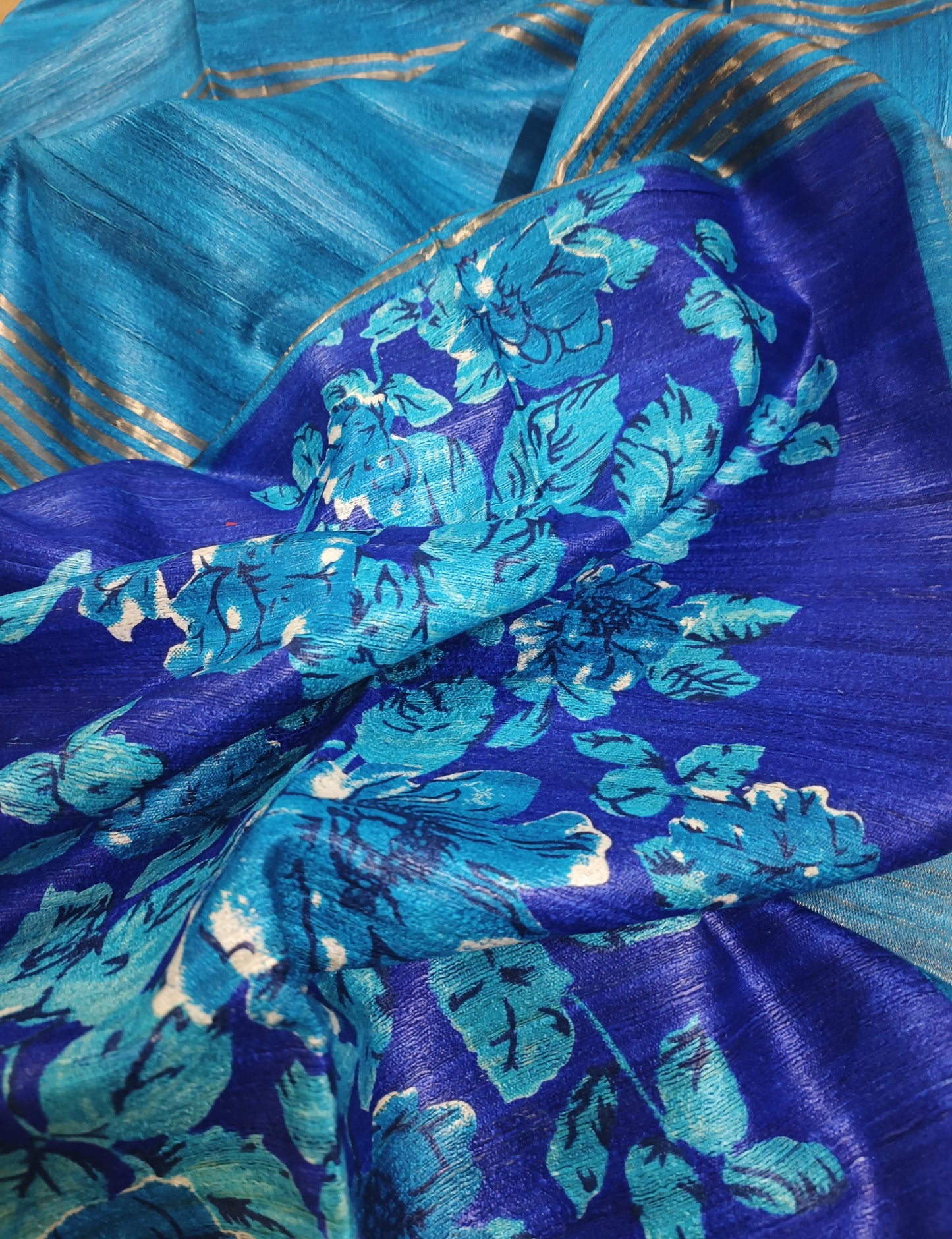 Blue Floral Printed Tussar Ghicha Silk Saree with Zari Border
