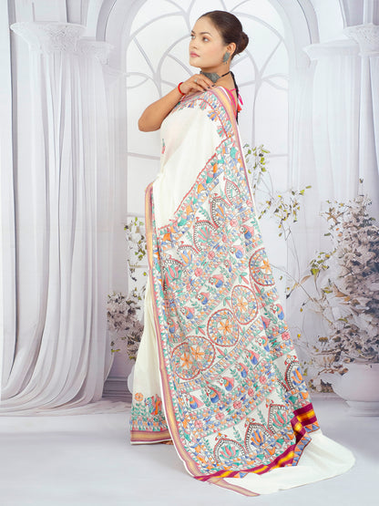 Traditional Madhubani floral design on Kerala cotton saree with contrast maroon border