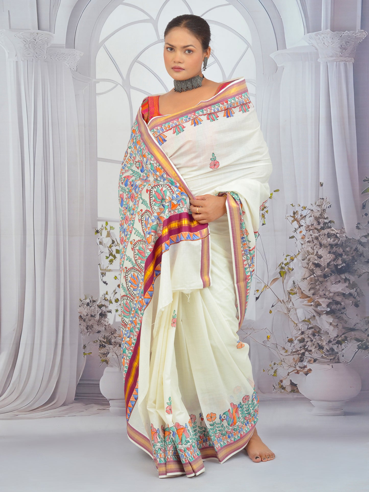 Hand-painted Kerala cotton saree featuring floral Madhubani art and maroon border