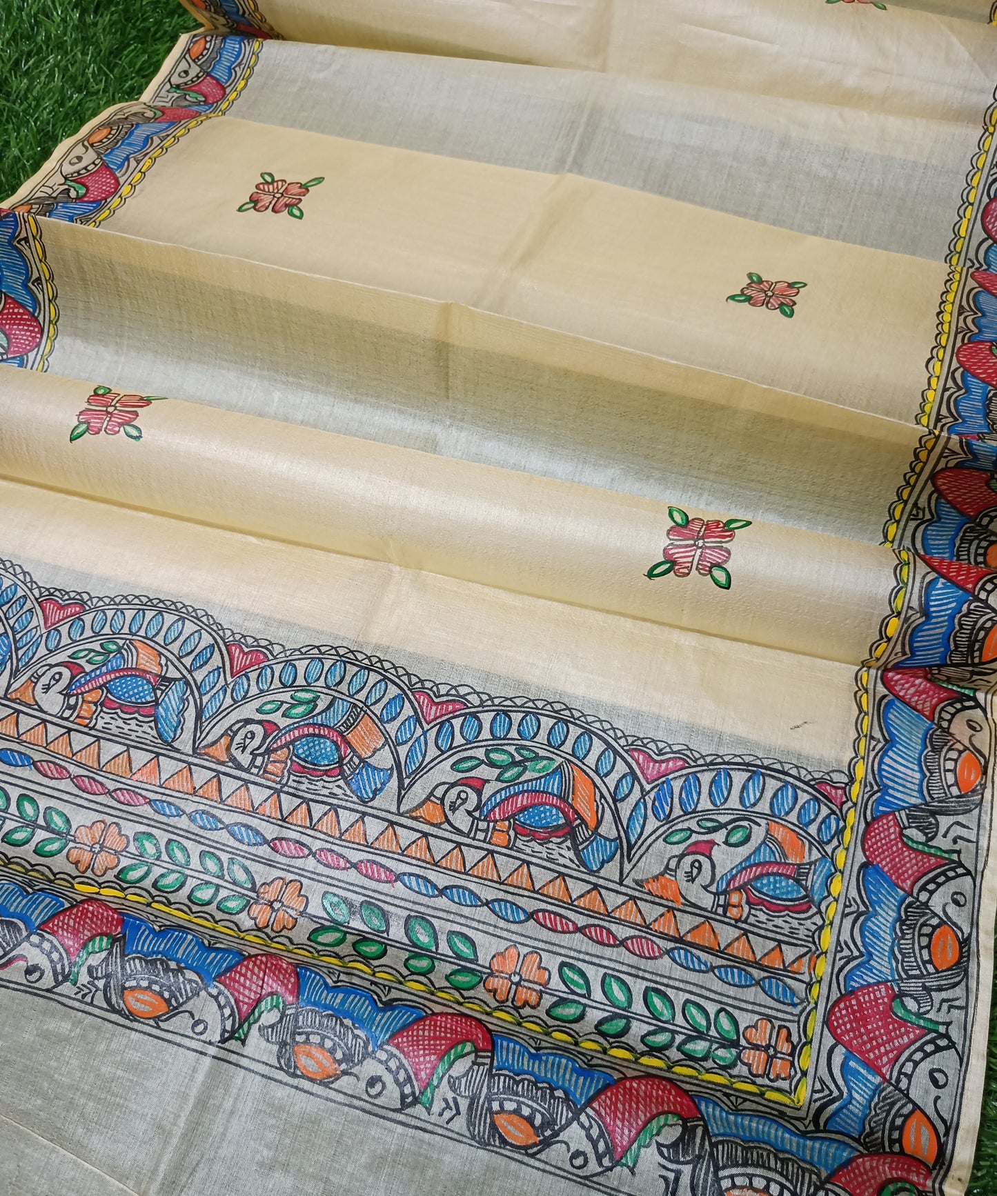 Pure off white  Madhubani Tussar silk stole featuring an extensive border of colorful hand-painted fish motifs and detailed panels of stylized birds