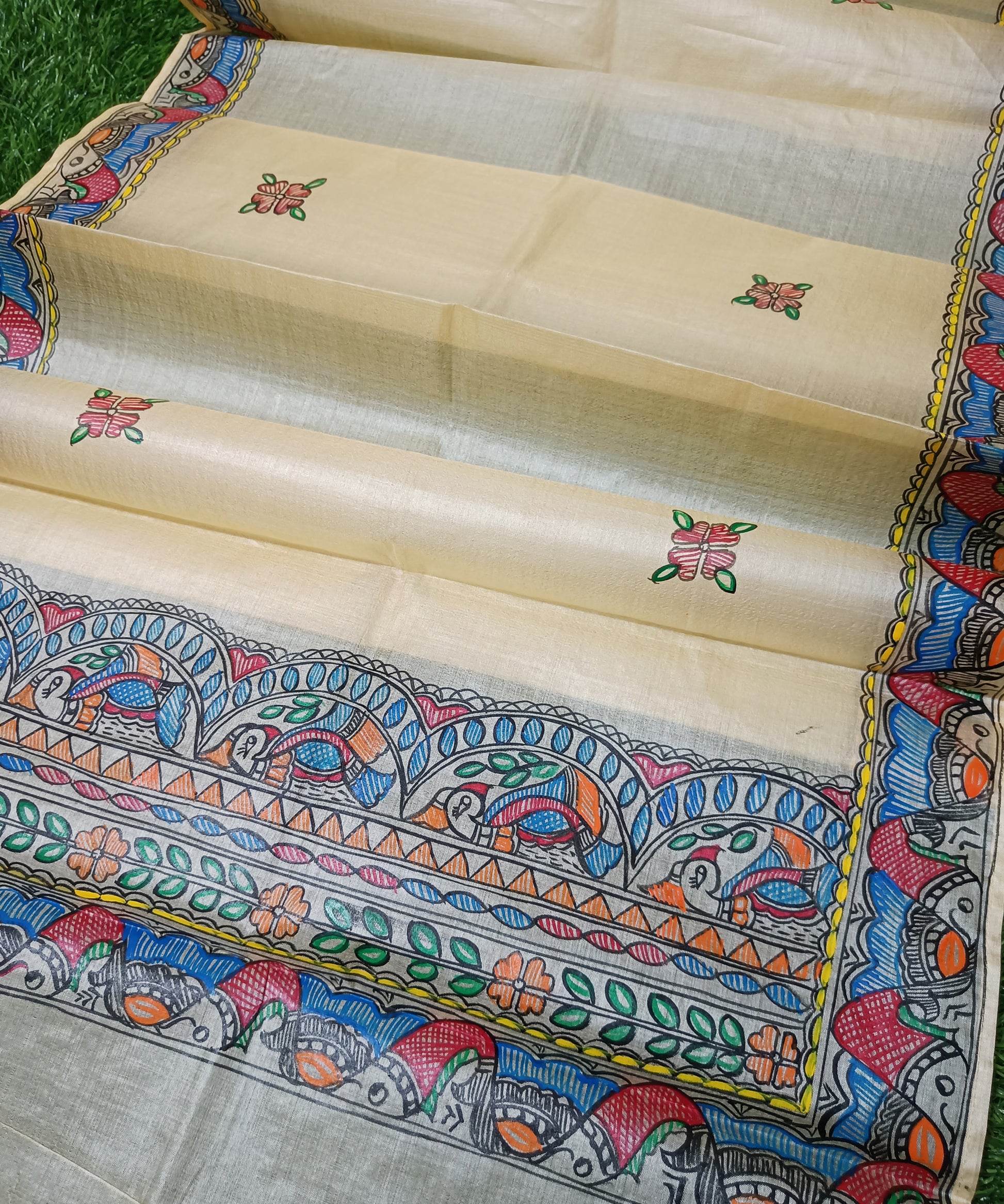 Pure off white  Madhubani Tussar silk stole featuring an extensive border of colorful hand-painted fish motifs and detailed panels of stylized birds