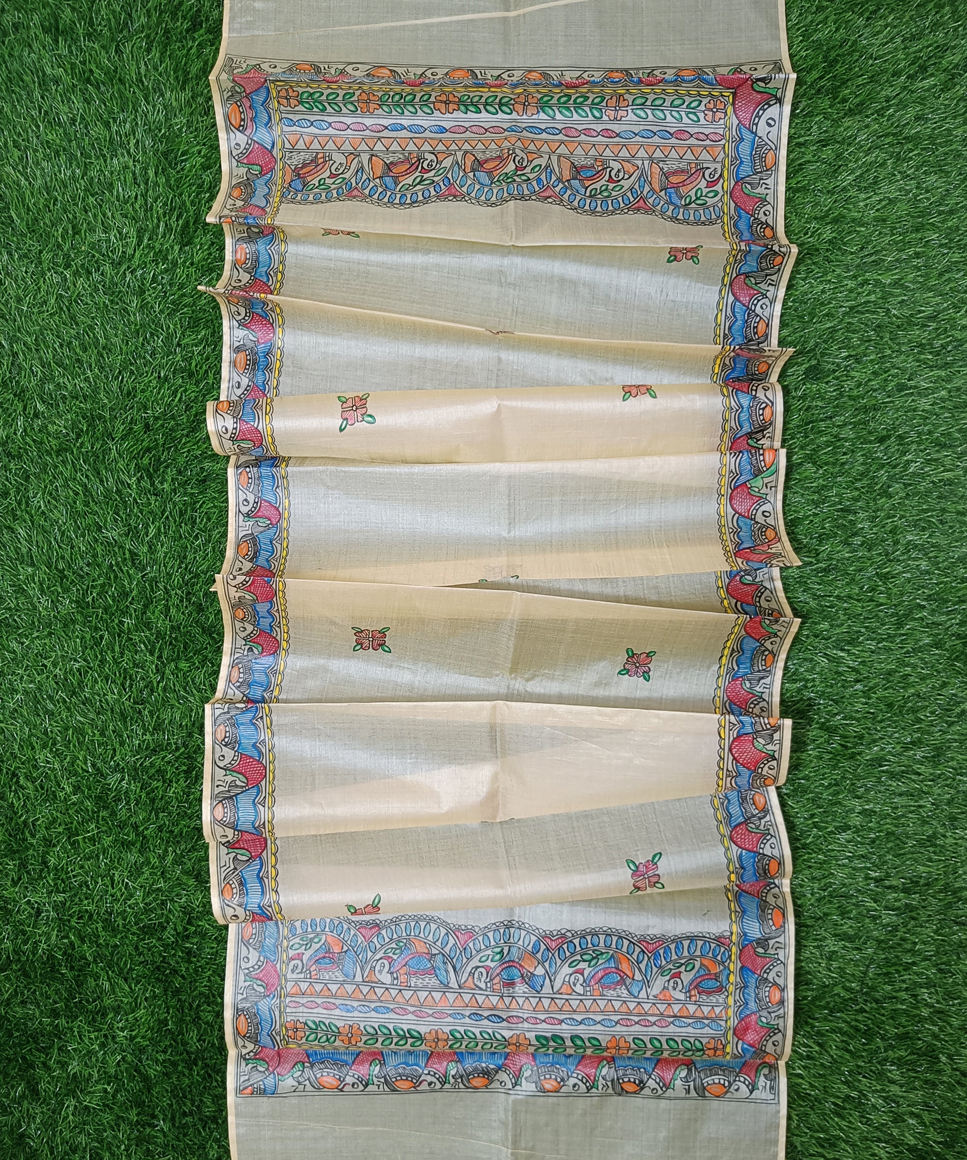 Natural cream Madhubani Tussar silk stole featuring an extensive border of colorful hand-painted fish motifs and detailed panels of stylized birds