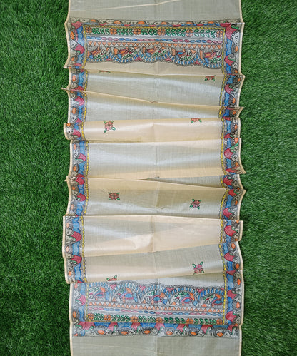 Natural cream Madhubani Tussar silk stole featuring an extensive border of colorful hand-painted fish motifs and detailed panels of stylized birds