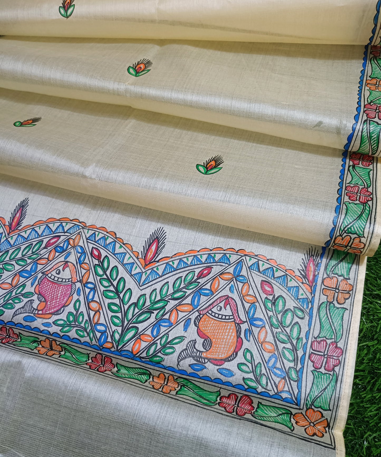 Hand-painted Madhubani Pure Tussar silk stole with colorful traditional fish and floral motifs on a natural cream background