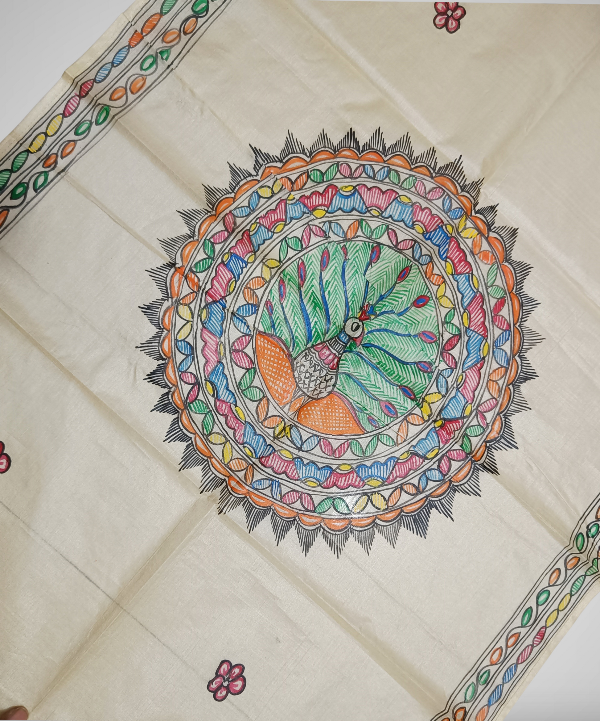 Hand painted Natural cream Madhubani Tussar silk stole featuring a colorful central circular peacock Motif and green leafy vine borders