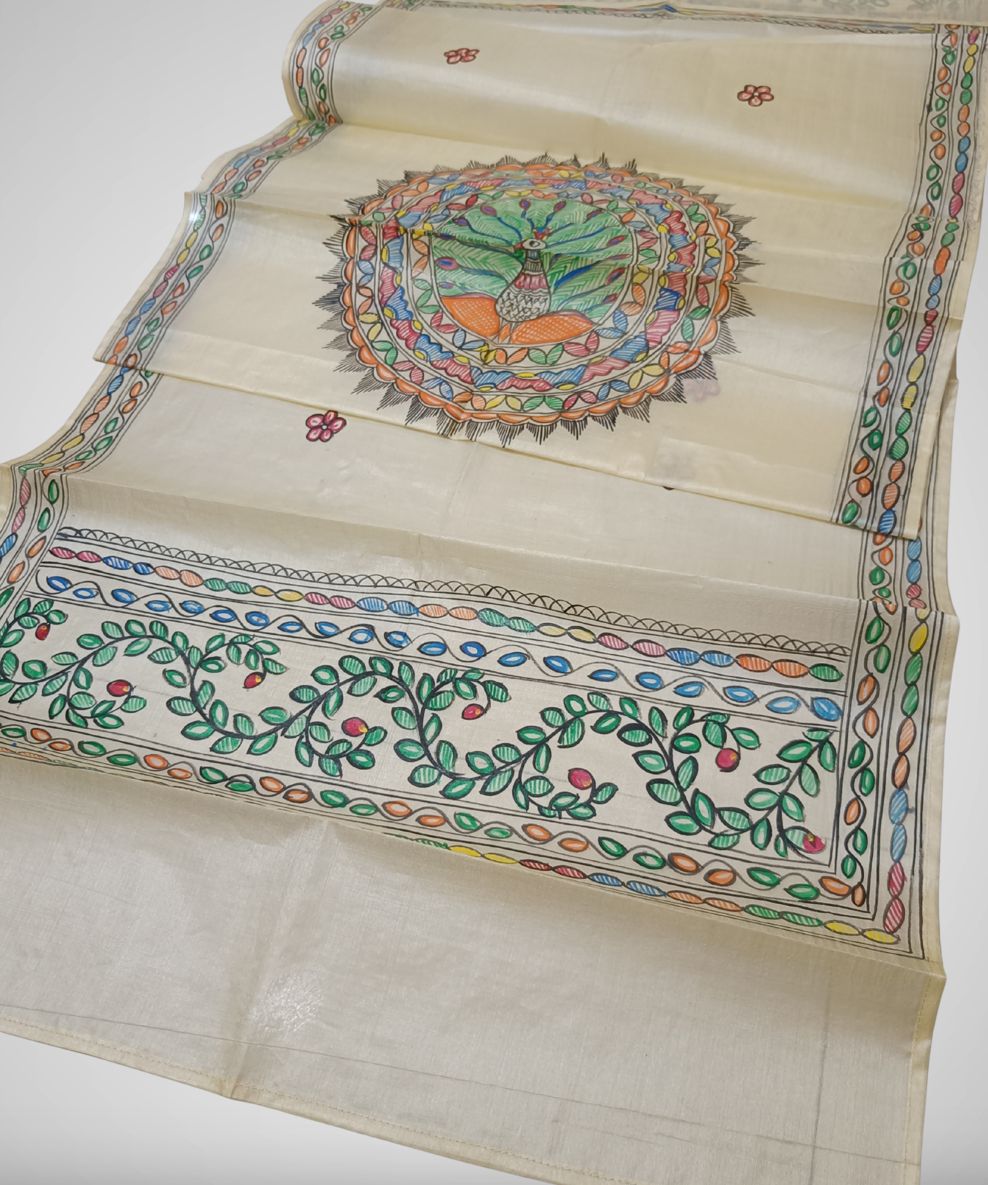 Natural cream Madhubani Tussar silk stole featuring a colorful central circular peacock mandala and green leafy vine borders