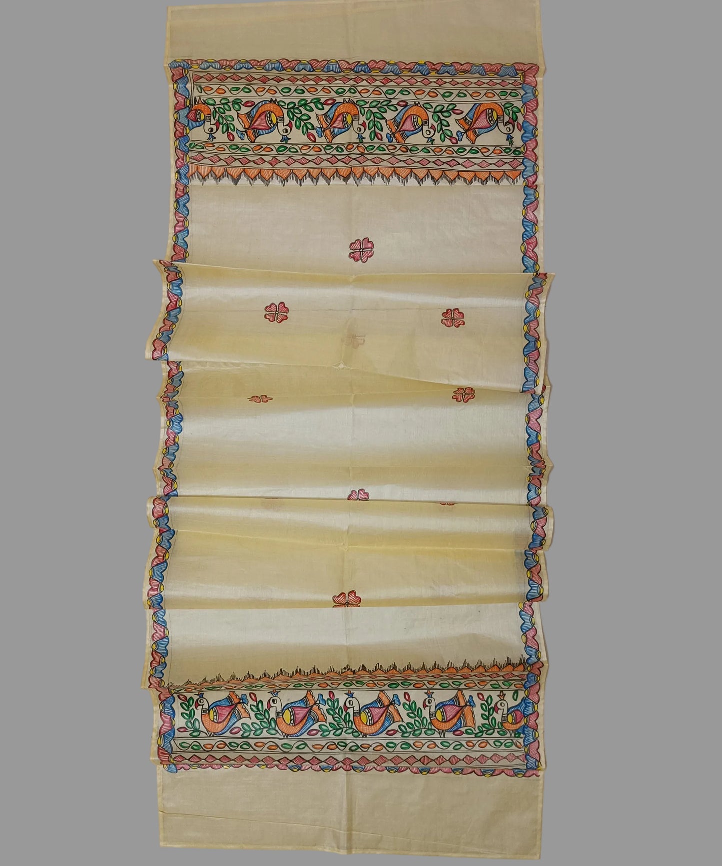 Natural beige Madhubani Tussar silk stole showcasing colorful hand-painted borders of peacocks, fish, and temple geometric patterns