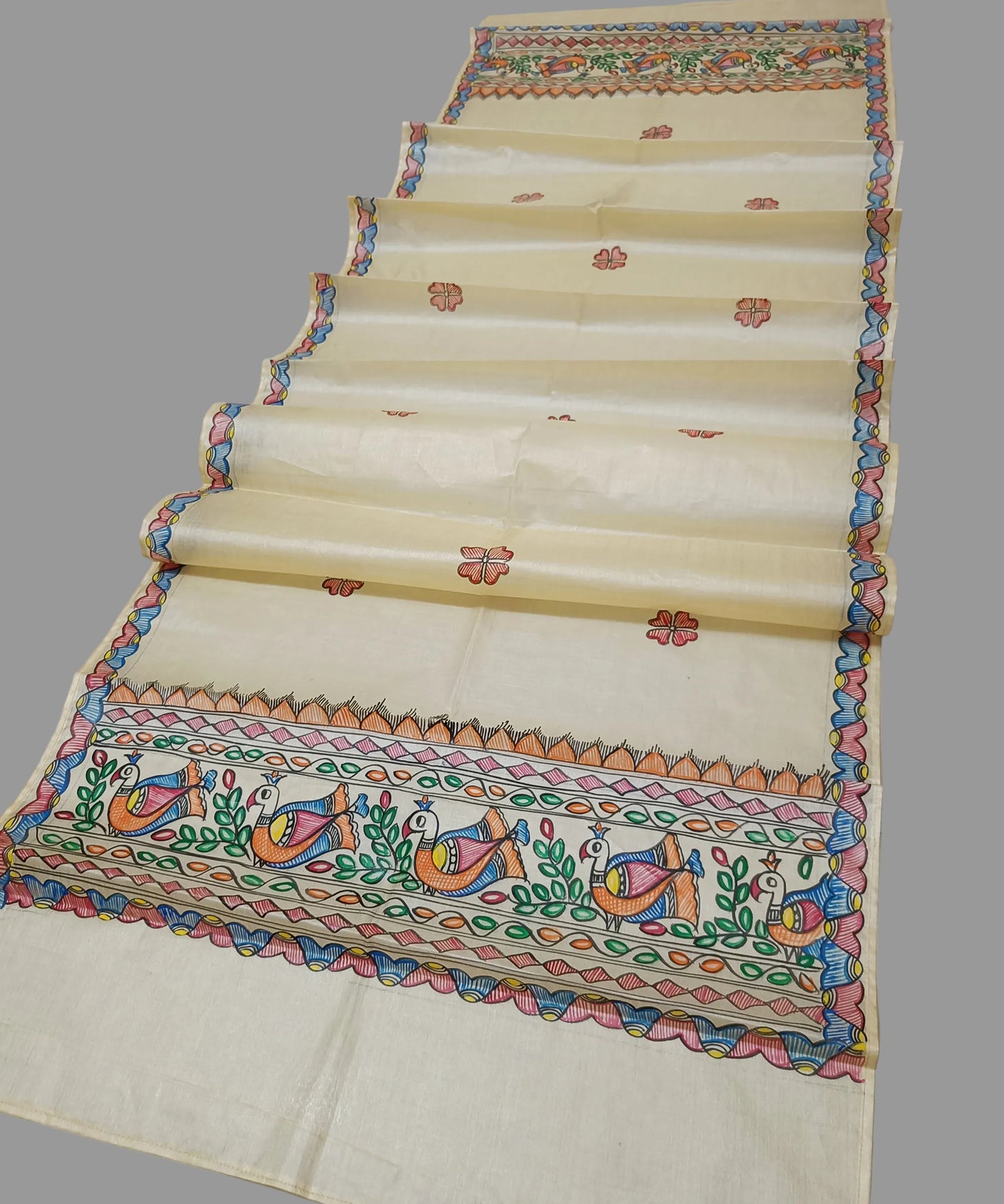 Natural beige Madhubani Tussar silk stole showcasing colorful hand-painted borders of peacocks, fish, and temple geometric patterns