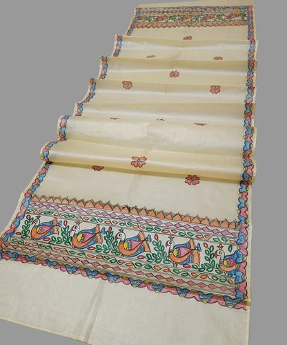 Natural beige Madhubani Tussar silk stole showcasing colorful hand-painted borders of peacocks, fish, and temple geometric patterns